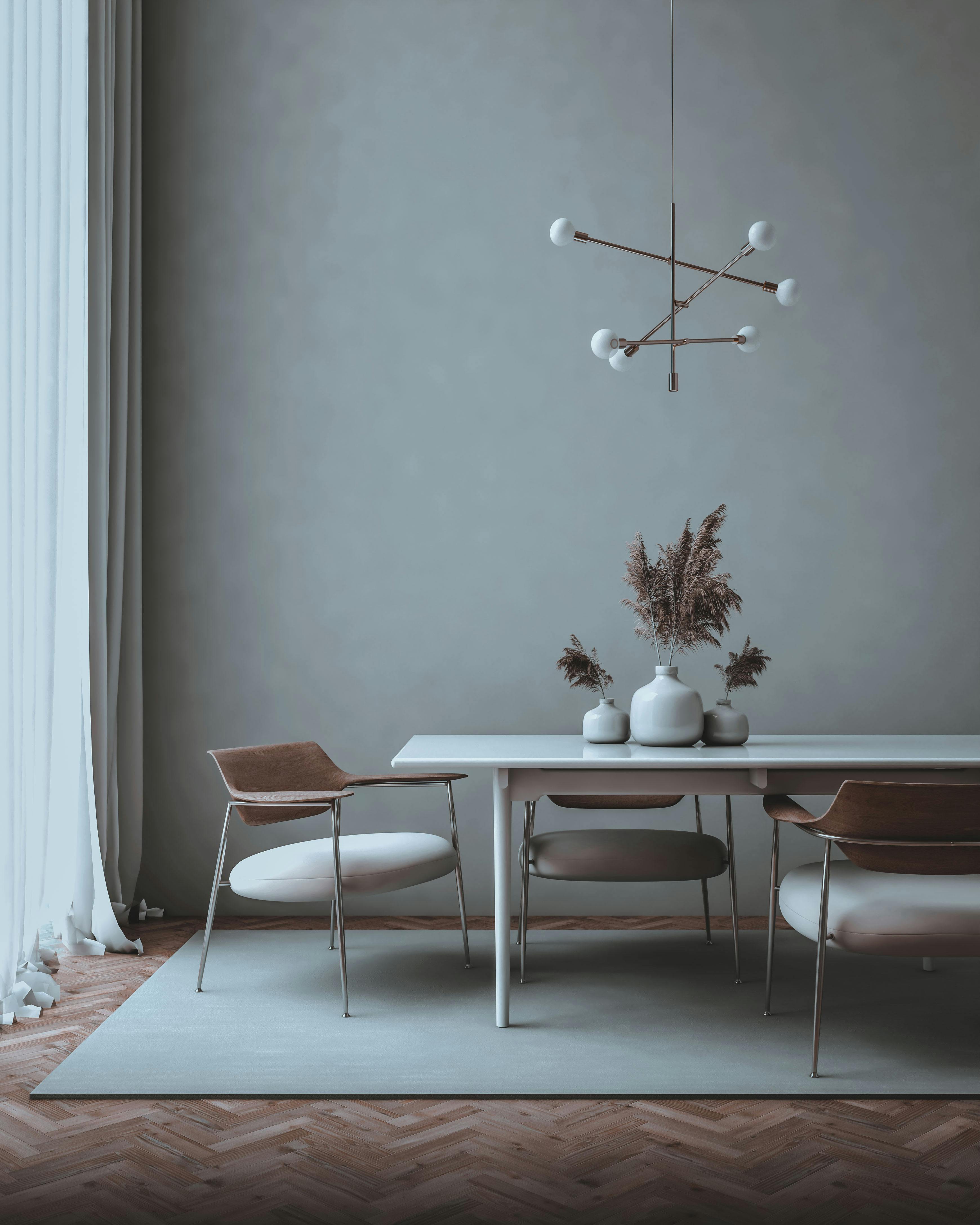 white vases on table in room