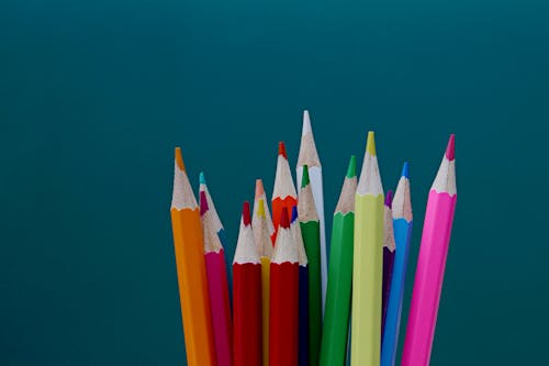 Free Multi Color Color Pencil on Blue Background Stock Photo
