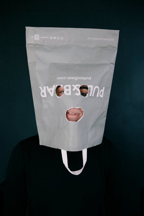 Free Paper Bag Over a Man's Head Stock Photo