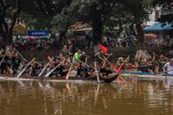 Vibrant dragon boat race with teams rowing in Siem Reap, Cambodia.