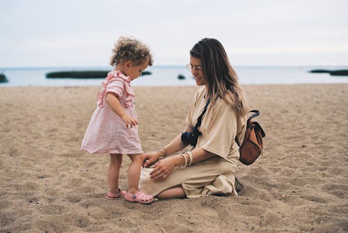 A Mother and Daughter in the Beach