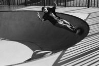 A Man Riding a Skateboard in a Skatepark