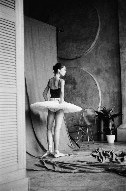 Free Elegant ballerina in black and white, poised in a studio with a chic modern design. Stock Photo