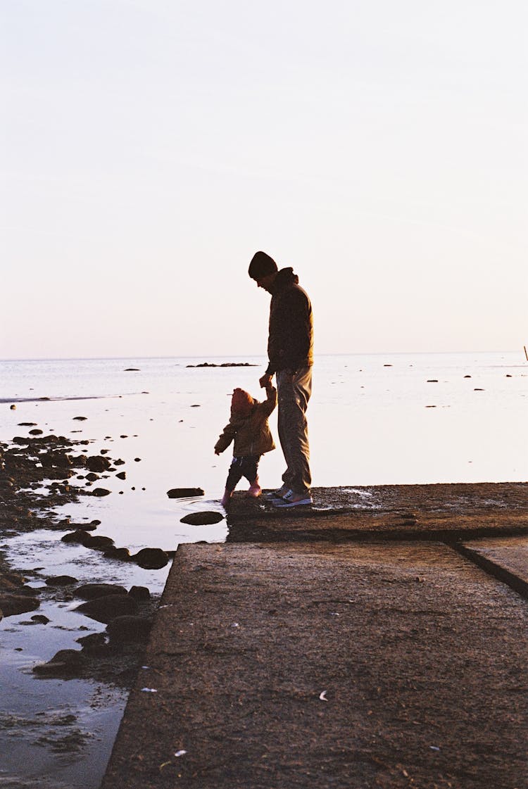 Father And Child On The Beach