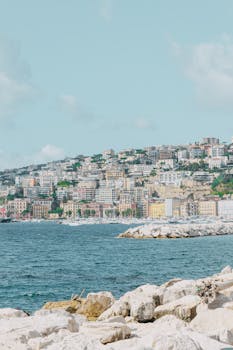 Beautiful coastal cityscape of Naples, Italy with the Mediterranean Sea.