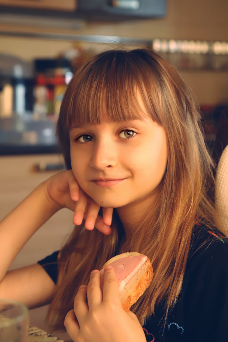 Girl Holding A Sandwich