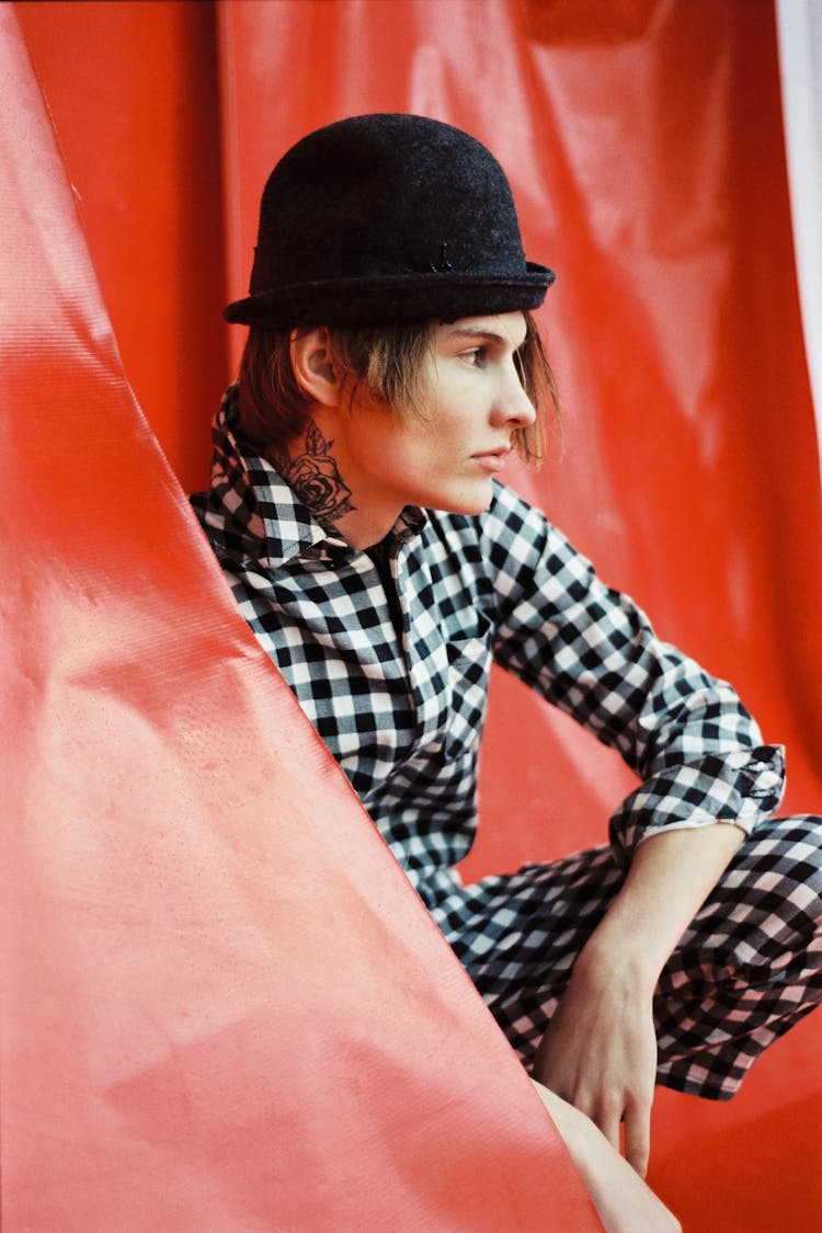 Young Man In A Checkered Suit And Hat