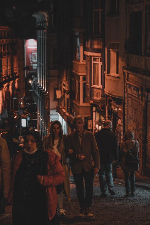 Free A night scene with couples walking through the charming streets of Istanbul. Stock Photo