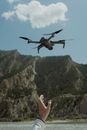 A Person Flying a Drone Machine