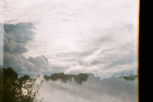 Free Dreamy landscape of sky reflecting in a tranquil lake at dawn, creating a peaceful and surreal scene. Stock Photo