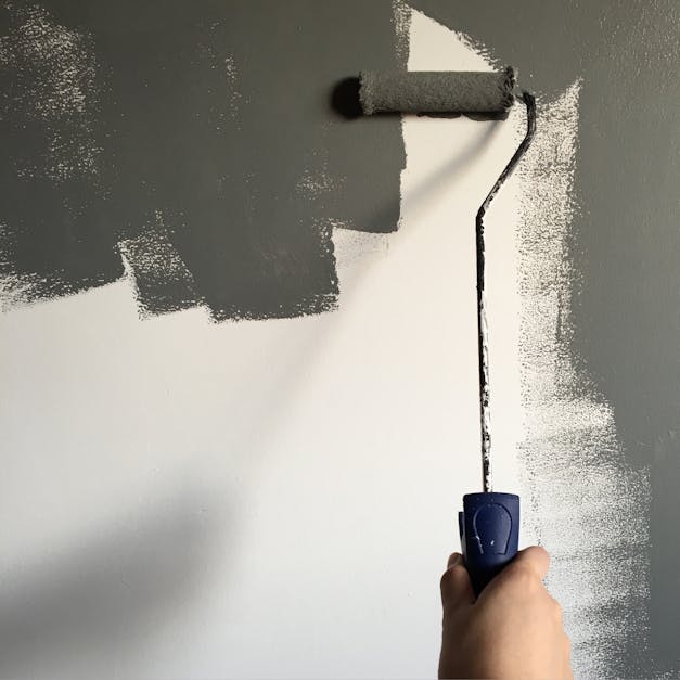 Person Holding Paint Roller While Painting the Wall · Free ... - 1200 x 627 jpeg 64kB