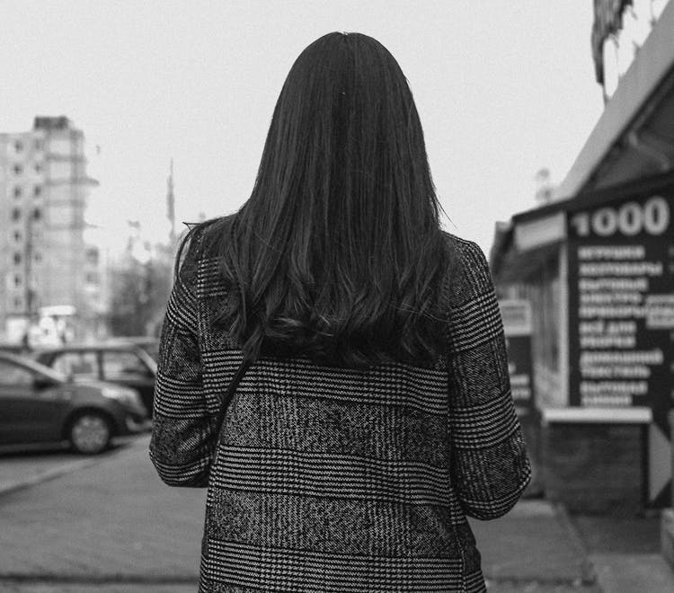 Rear View Of Woman In City