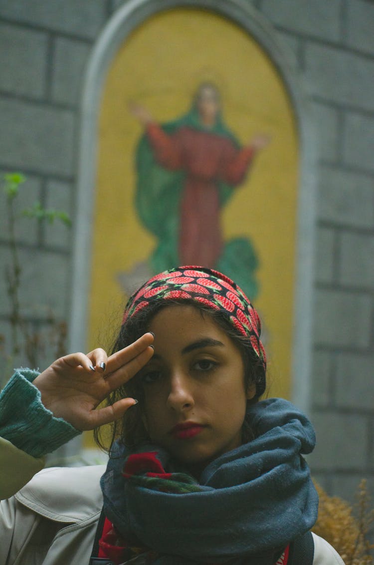 Woman With A Bandana Doing A Salute