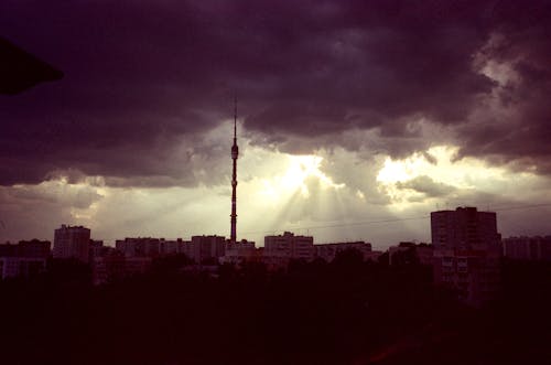 Sunlight Through a Cloudy Sky Over a City