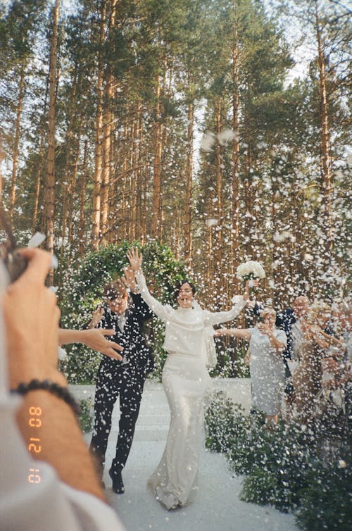Free Newlyweds Celebrating in Forest Stock Photo