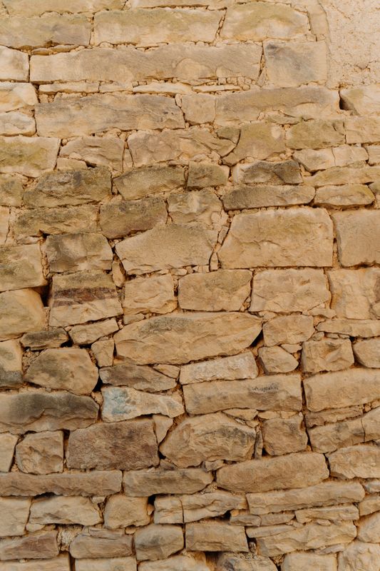 Courses of cut stone in an old wall - Two Words for Temple