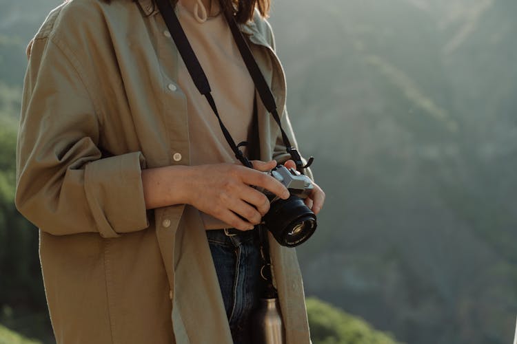 Woman Holding A Camera