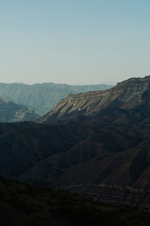 Free Explore the serene beauty of a vast mountain landscape captured at dusk. Stock Photo