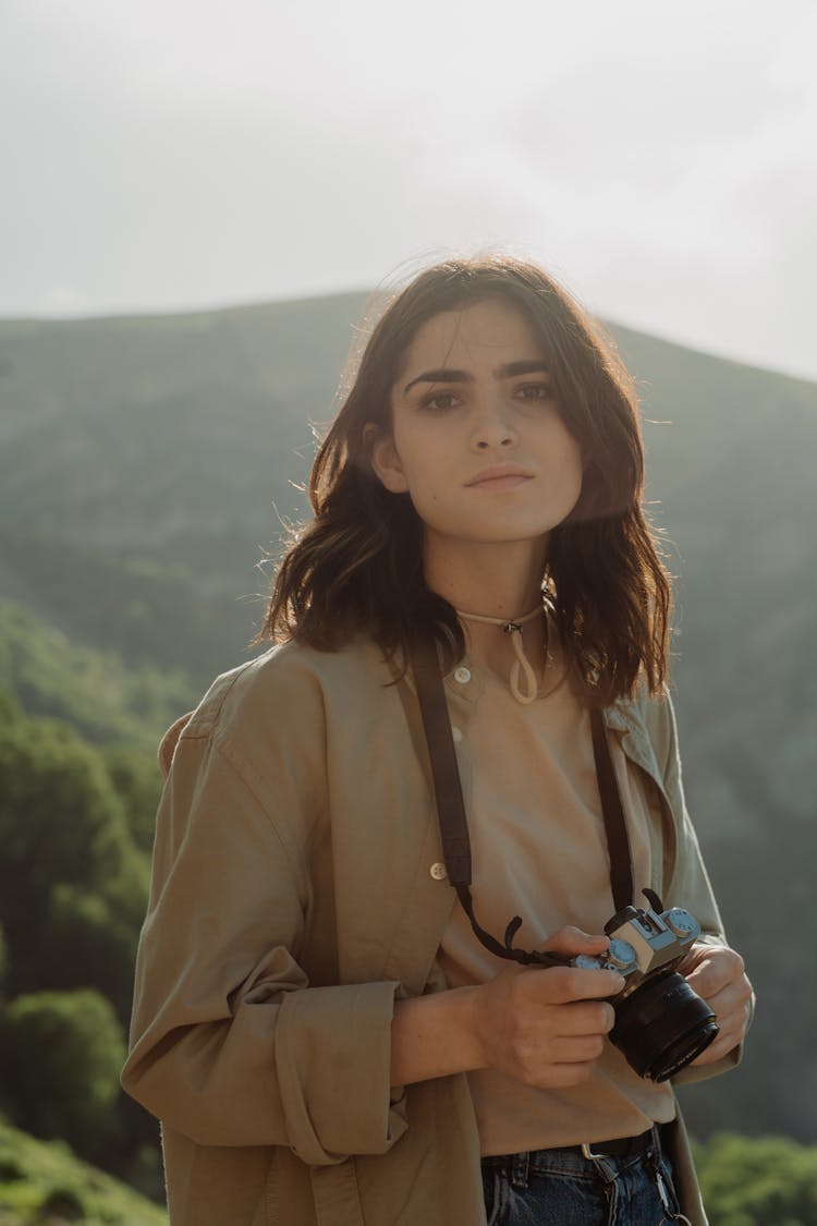 Close-Up Shot Of A Woman Holding A Camera