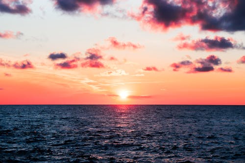 Free stock photo of beach sunset, blue ocean, sunset colors