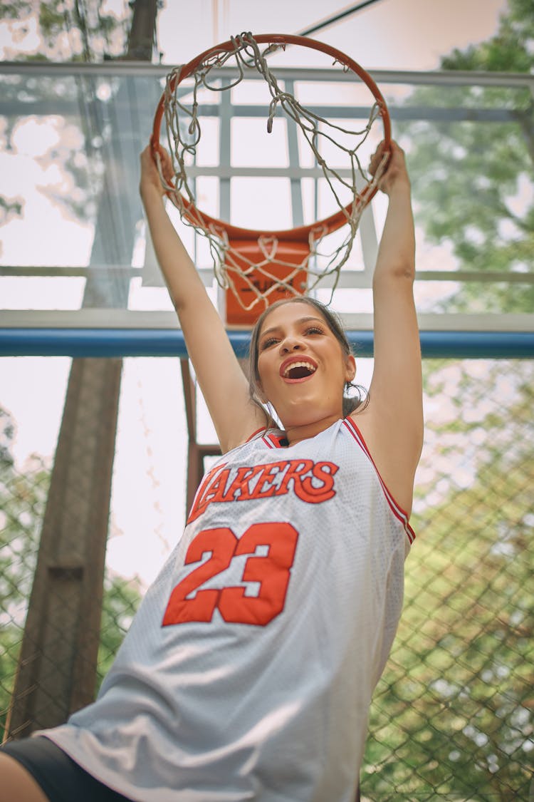 Woman In LA Lakers T-shirt Holding Basketball Ring