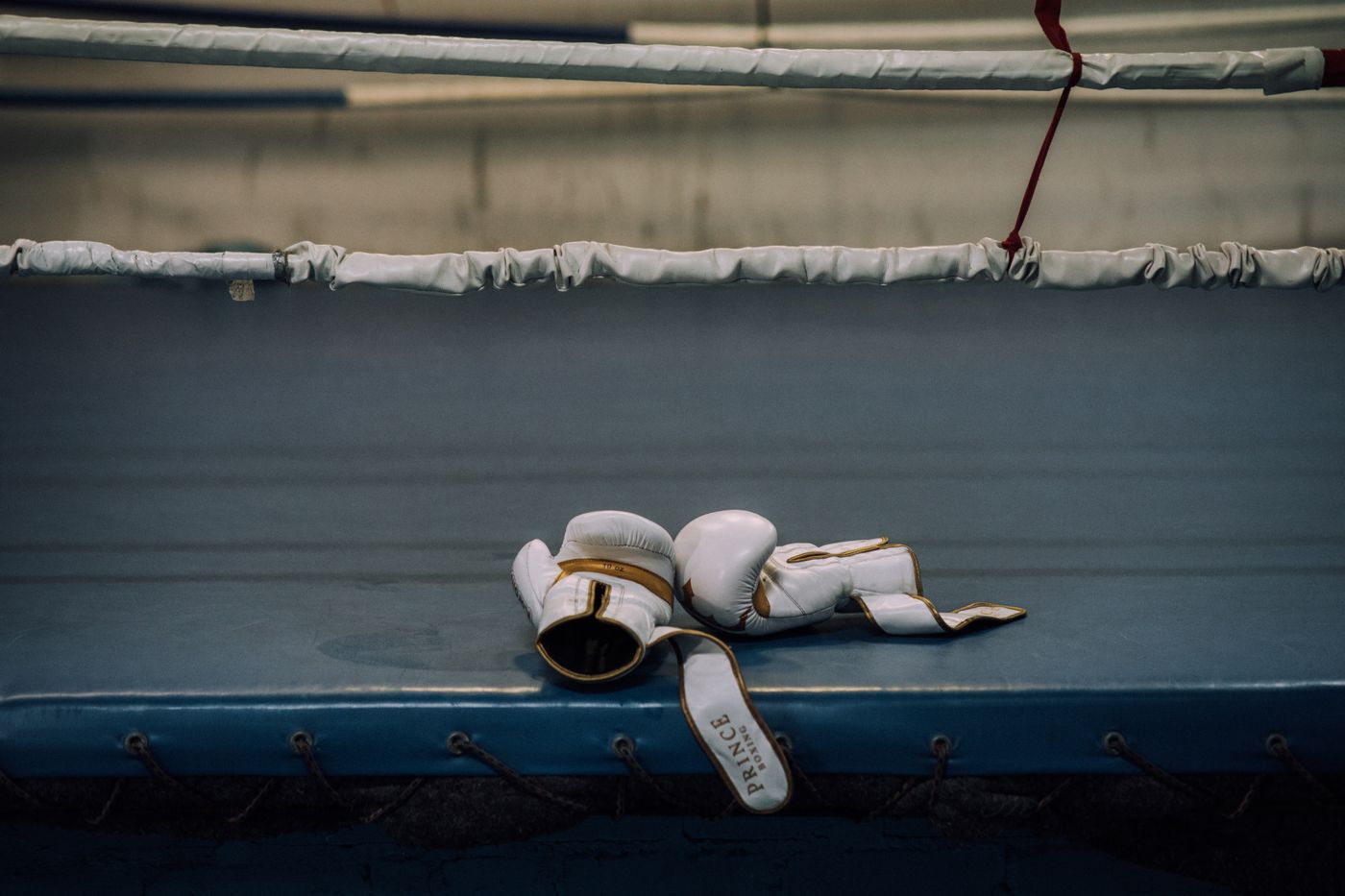 Boxing gloves resting in a ring at an American sports venue streamed through a US IPTV provider