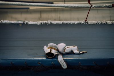 Gloves and wraps left on the ring apron — photo by KoolShooters on Pexels
