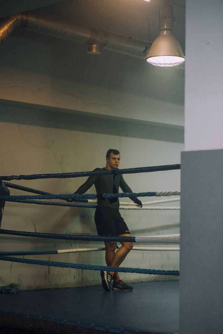 A Man Standing Inside The Boxing Ring