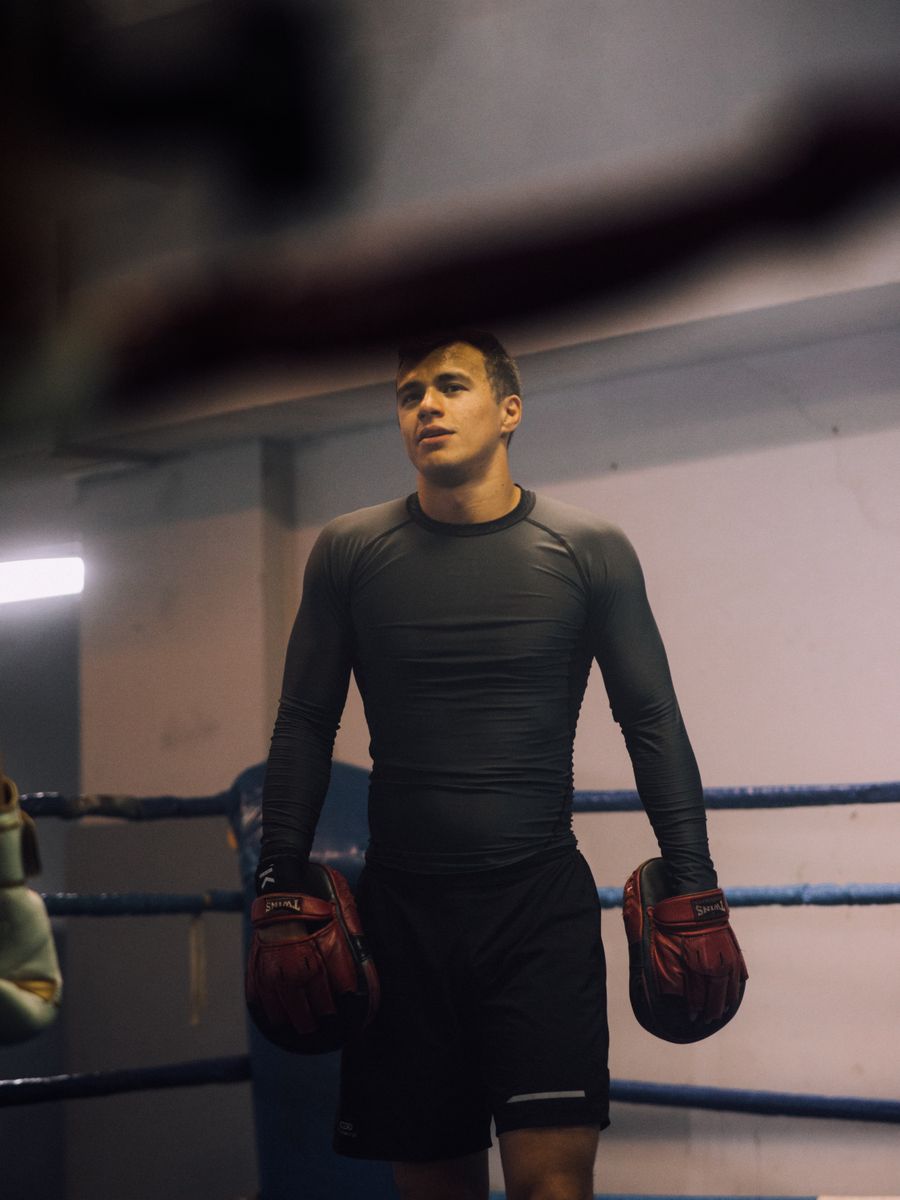 Boxer standing ready in the ring with gloves on
