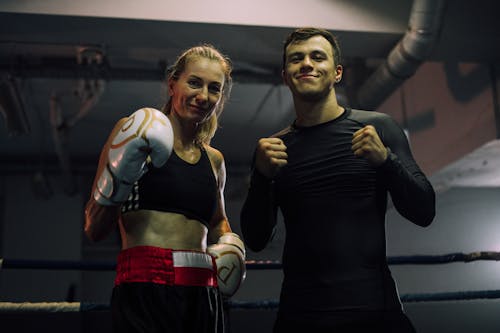 A Woman in Sportswear Wearing Boxing Gloves