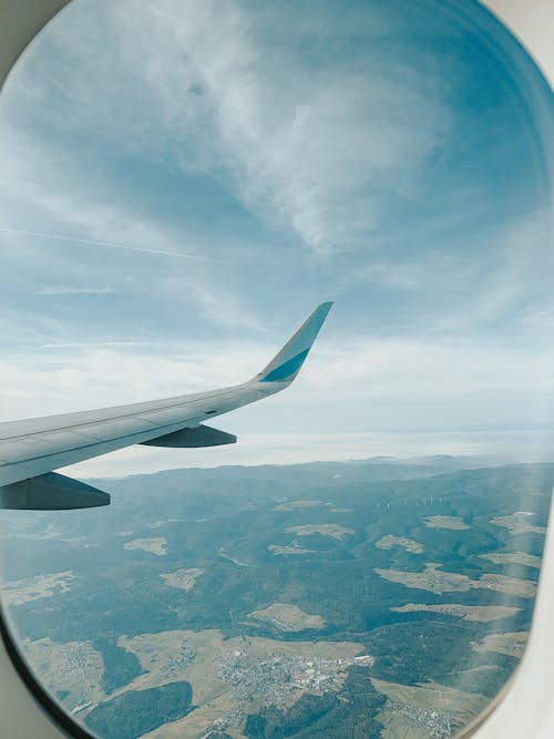 Free View of the Beautiful Scenery from the Window of an Airplane Stock Photo