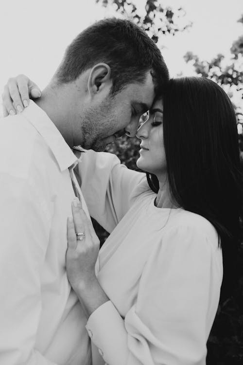 Black and White Picture of Woman and Man Embracing Each Other