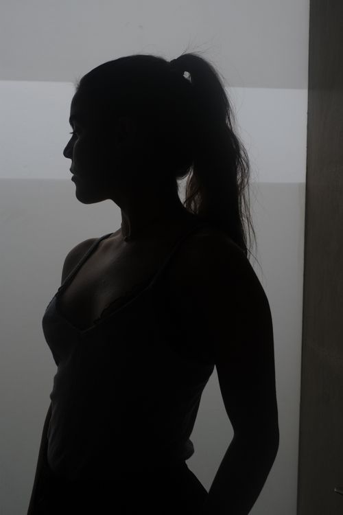 Free Artistic silhouette of a woman posing against a monochrome background. Stock Photo