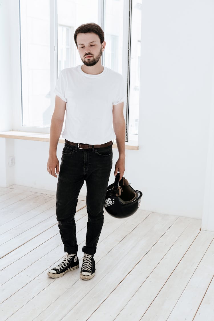 Standing Man Holding Motor Cross Helmet