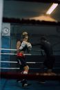 A Man and Woman Inside the Boxing Ring