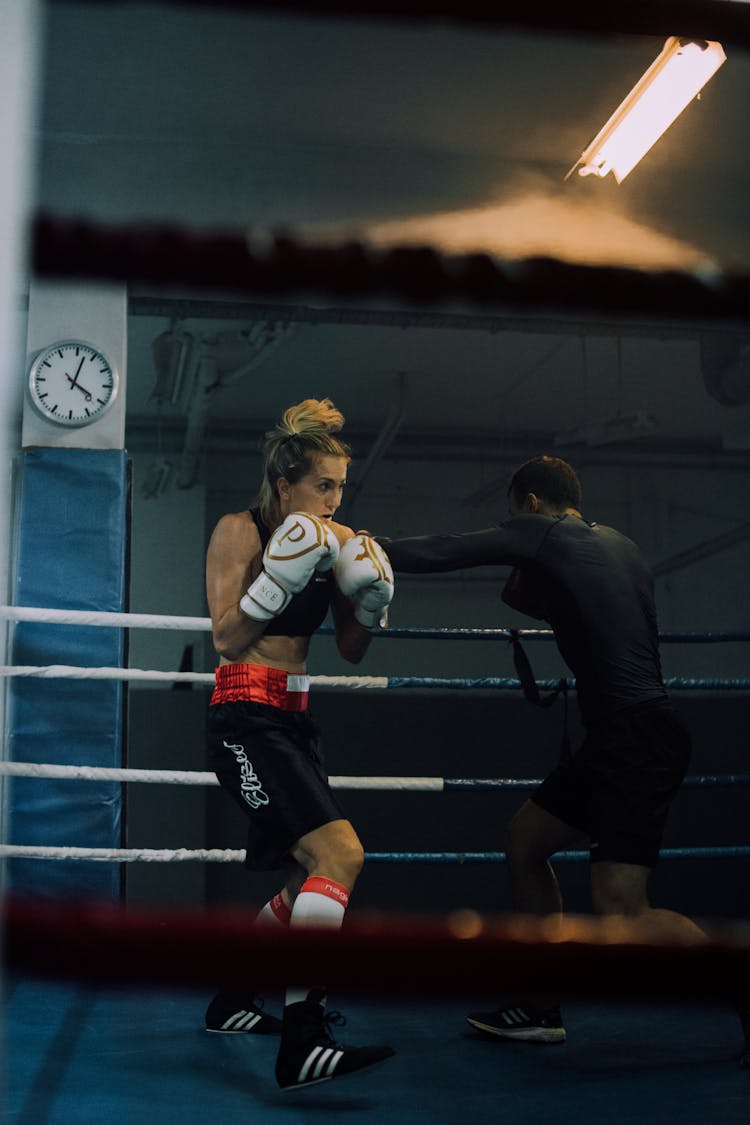 A Man And Woman Inside The Boxing Ring