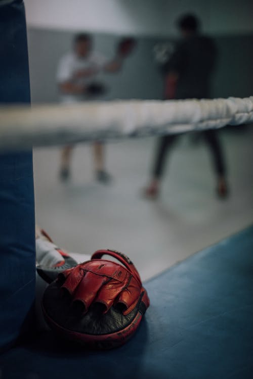 A Close-Up Shot of a Red Boxing Training Gloves