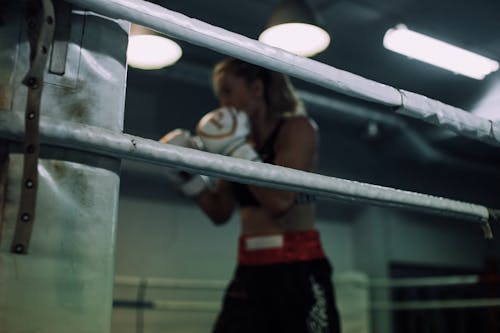 A Woman Wearing White Boxing Gloves