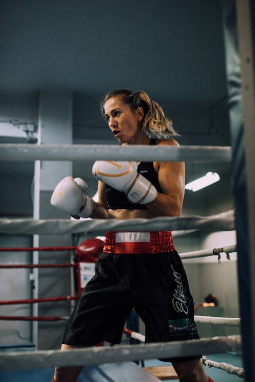 A Woman Training in a Boxing Ring