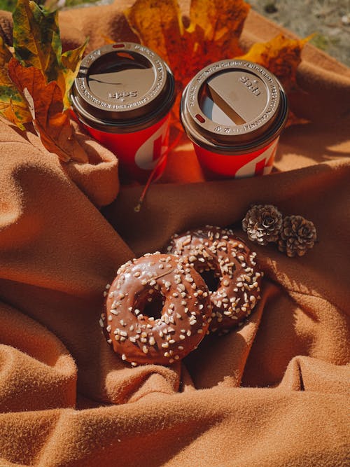 Doughnuts Beside Disposable Cups