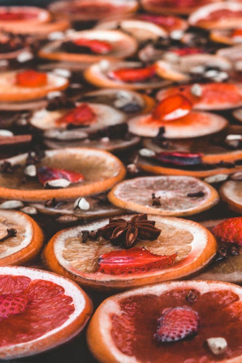 Slices of Fruits and Spices in Water