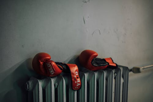 Red Boxing Gloves Near the Wall