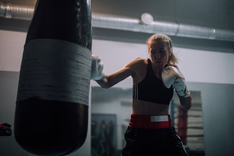 Woman Training With A Punching Bag