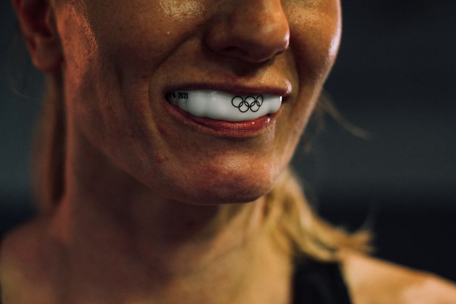 Athlete wearing a protective sports mouthguard