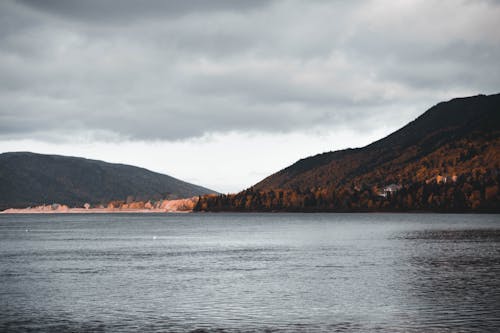 Overcast over Lake Surrounded by Hills