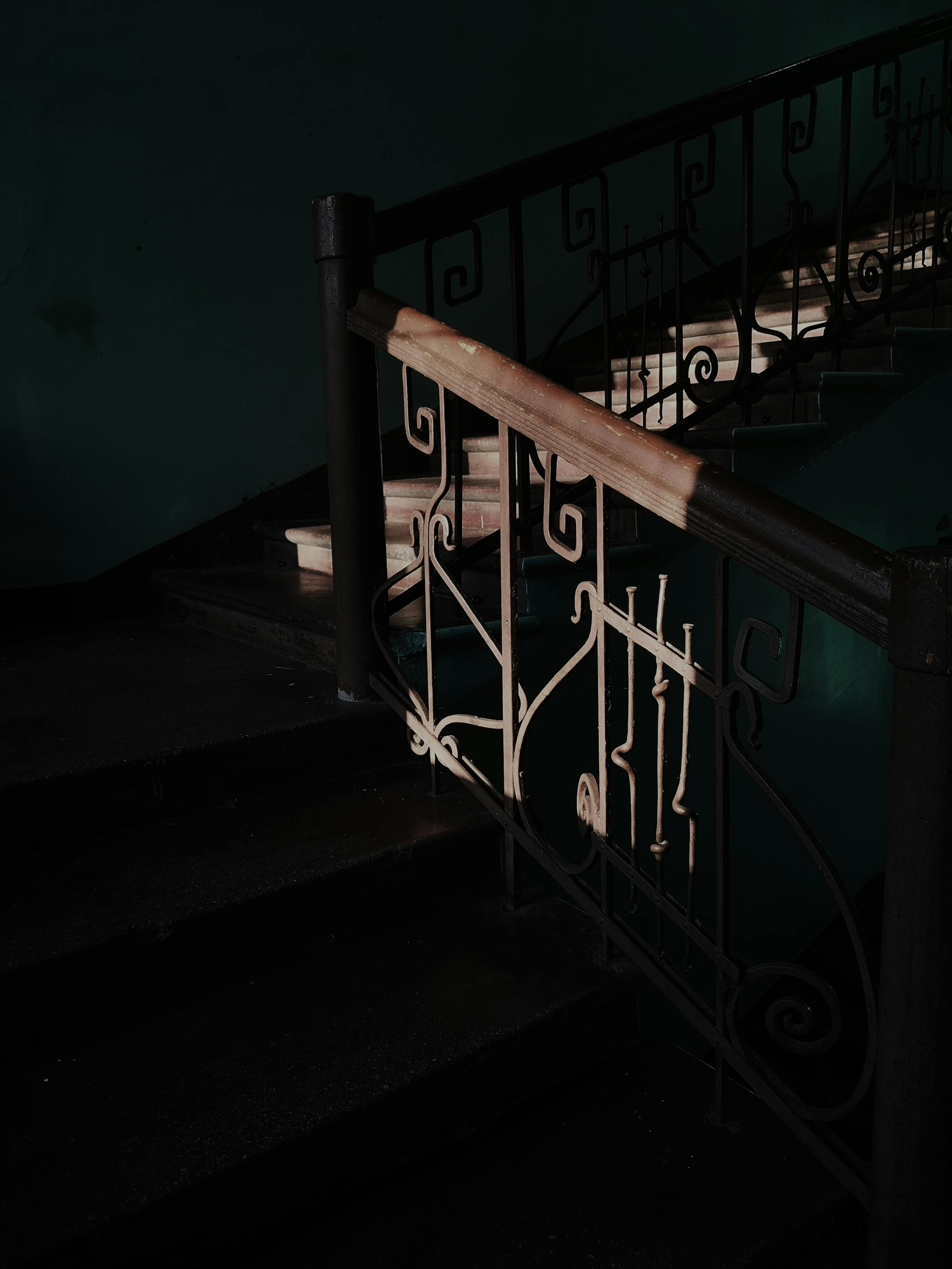 Black and Brown Stairs Beside Window · Free Stock Photo