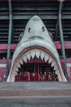Creative stadium entrance shaped as a giant shark mouth, capturing imagination.