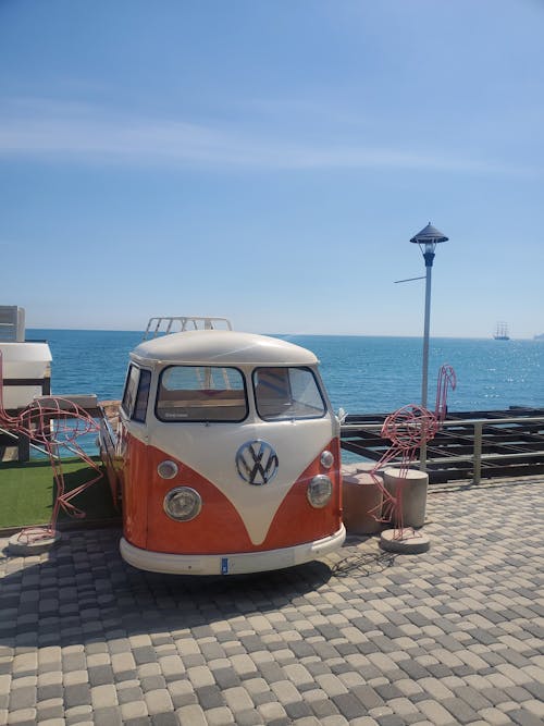 A Vintage Car Parked Near the Ocean