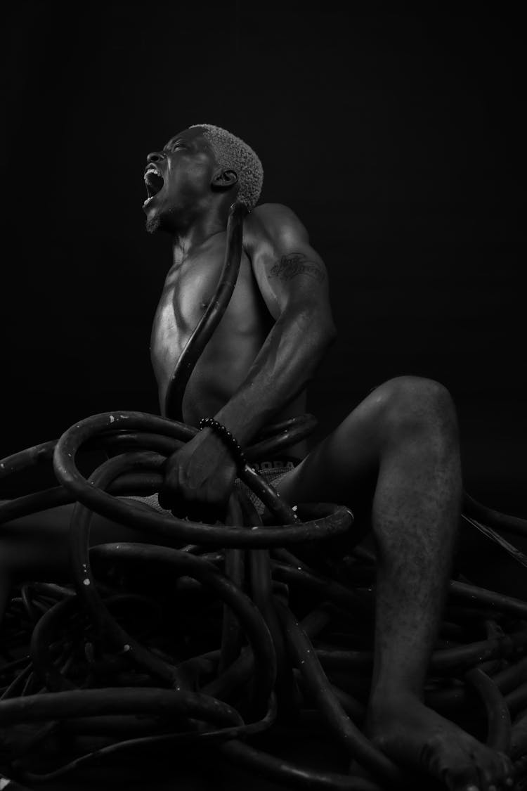 Man With Ropes Around Body