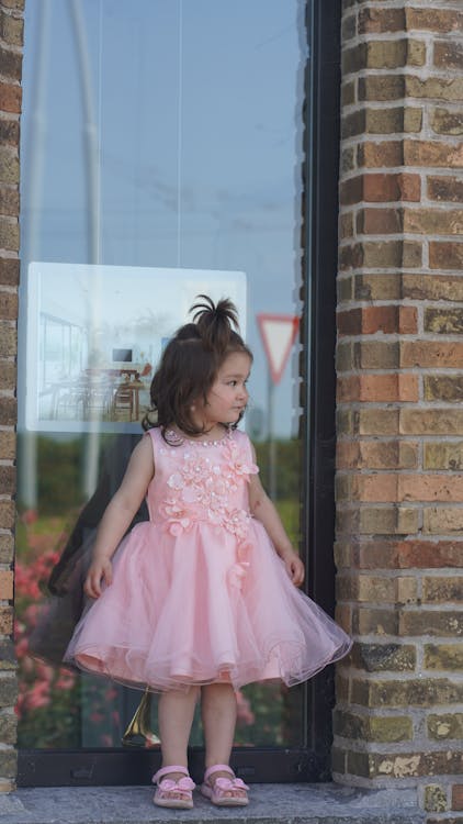 A Cute Girl Wearing Pink Dress